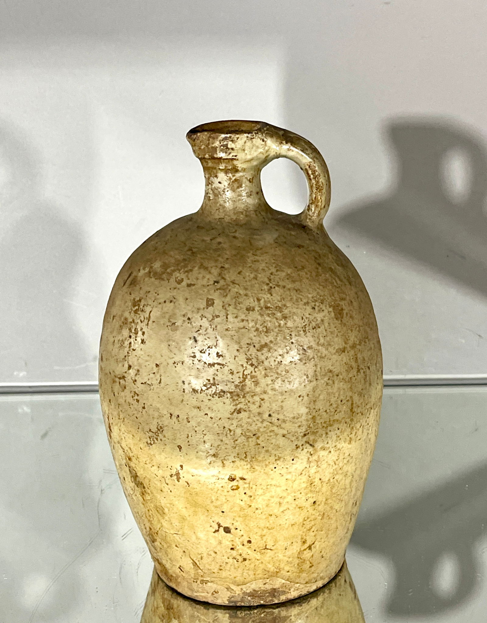 19th C French Hand Thrown Walnut Oil Jar: Rustic glazed. DIMENSIONS: 11 1/2"t x 6 1/2"w ORIGIN: France CIRCA: 1870.