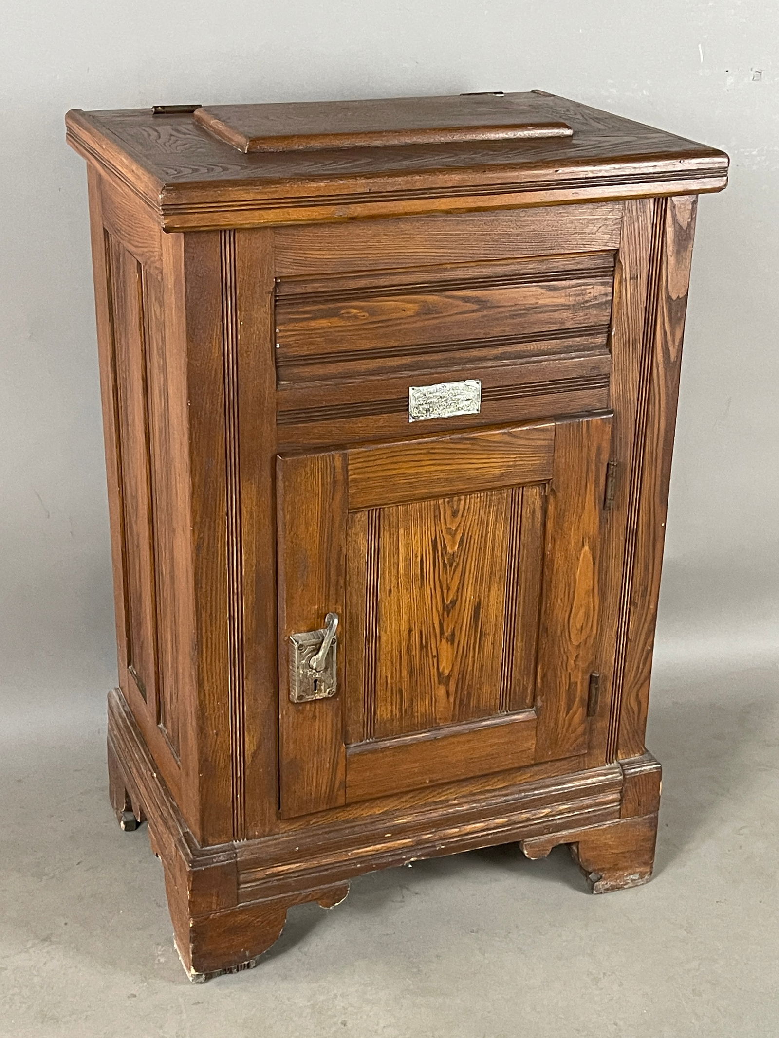 "The Leonard Refrigerator" Oak Ice Box: Turn of the century, lift top and on door in frame. ORIGIN: Grand Rapids, Michigan DIMENSIONS: 41"t x 18"d x 26 1/2"w CIRCA: 1905.