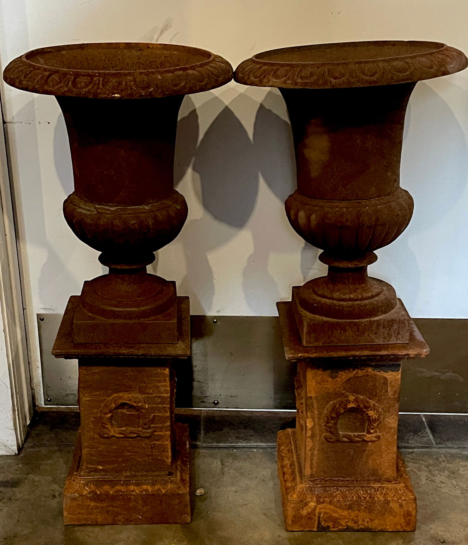 Pair of Vintage French Garden Urns: Classical style with fluted sides and matching bases. 30”t.13”d . France 20th.c