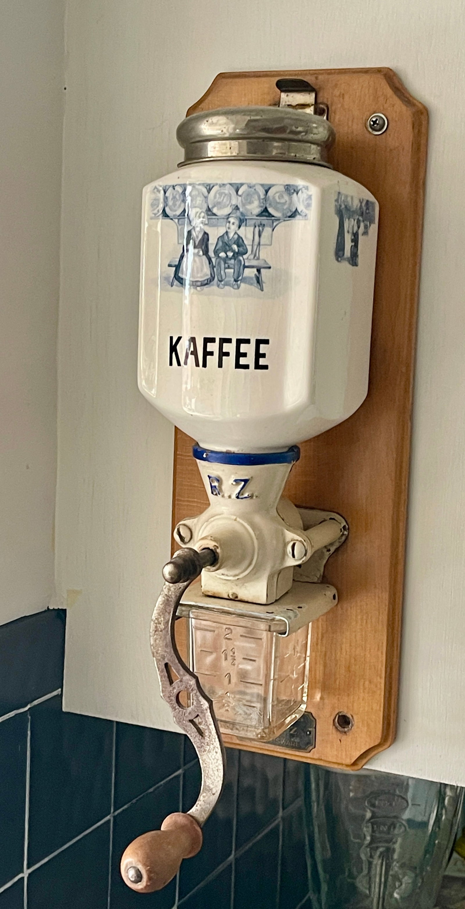 Vintage Dutch Coffee Grinder: Wall mounted. CONDITION: working DIMENSIONS: 16"t x 7"d x 6"w ORIGIN: Holland CIRCA: 1920.