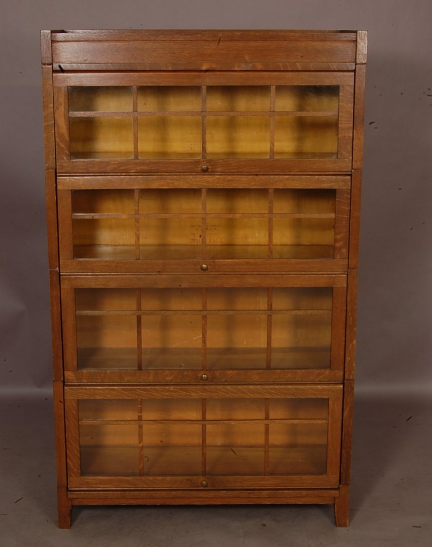 Arts & Crafts style Oak Lawyers stacking bookcase: 4 Sectional with overlay doors 59" t x 35" w x 12" d Manufactured by Gunn Bookcase Co. Ca. 1910