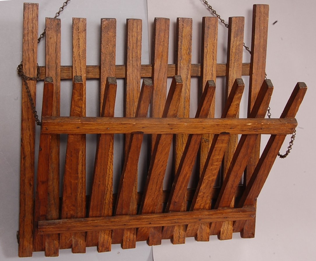 Arts & Crafts style oak magazine wall rack: 16" t x 17" w. Ca. 1910