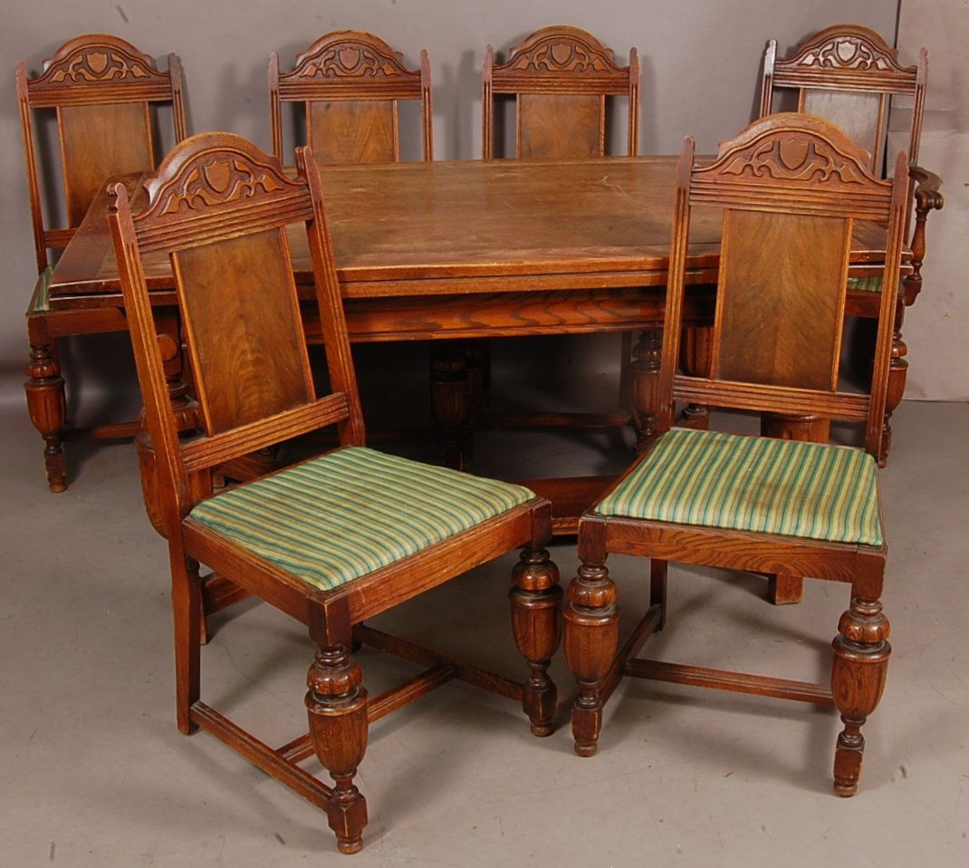 American 1920's oak dining room set: With pull out extension table. 5 side chairs & 1 arm chair. 31" t x 38" w x 52" . Ca. 1920