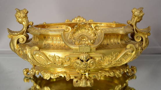 French Louis XV style Dore Bronze Center piece: With shell carving on sides, bust of women on ends, floral & leaf decorated on all sides. 18" l x 8" t x 12" w. Ca. 1860