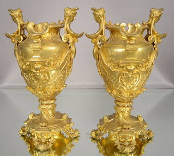 Pair of French XV style dore bronze vases: Floral & leaf decorated sides & base with womens bust on ends. 12" t x 7" w. Ca. 1860.