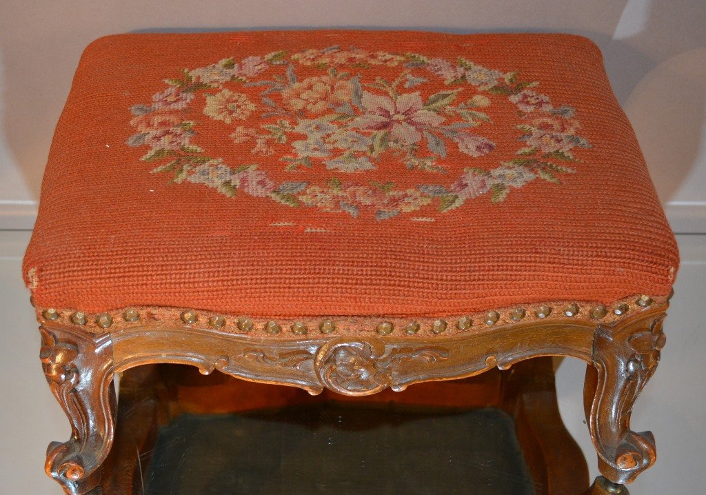 French Louix XV style walnut footstool: With needle point upholstery. 8" t x 12" d