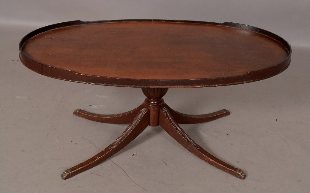 Sheraton style oval low table: Ca. 1920 17" t x 18" d x 36" l.