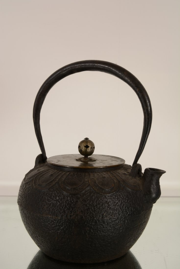 Oriental style cast iron tea pot: With bronze lid. 9" t x 7" w Ca. 1900