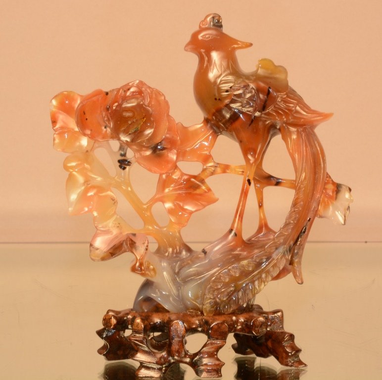 Chinese carnelian agate stone Carving of Phoenix Bird: Varations of colors in browns, blacks, cream with conforming wood base. 6"t. 20Th cent.
