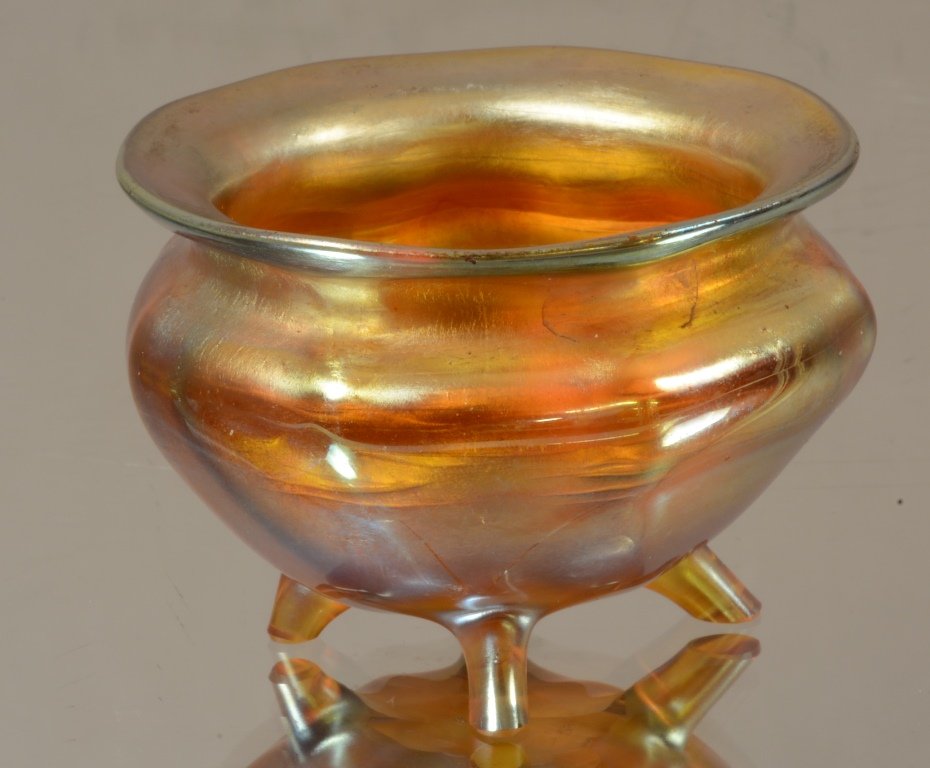Tiffany gold Favrile footed salt: Ribbed sides. 4 footed base. Signed L.C.T. 2 1/4" d. Ca. 1910