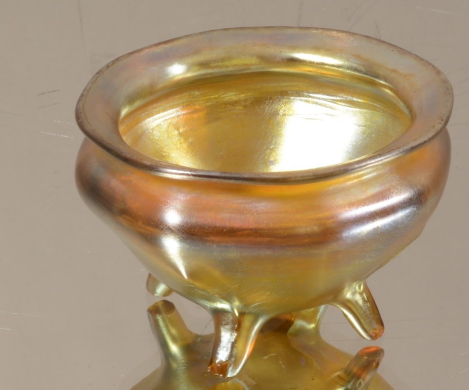 Tiffany Favrile Gold Footed salt: Ribbed design on sides. Signed L.C.T. 4 footed base with Small flake on foot. 2 1/4" d. Ca. 1910