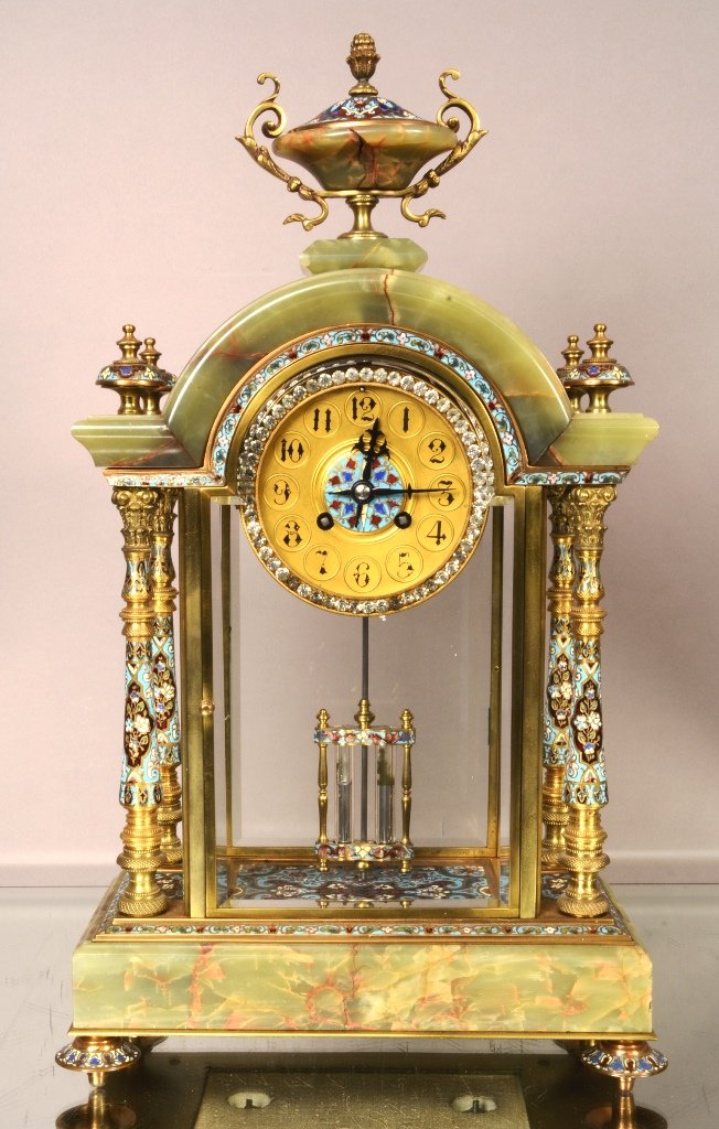 French Cloisone & Onyx mantel clock: With enameled urn finial, decorated dial with jeweled ring, excellent detail on bronze & enameled columns, cloisonne floor, Mercury pendulum. Works signed L.Marti. 20" t x 12" w. Ca. 1895