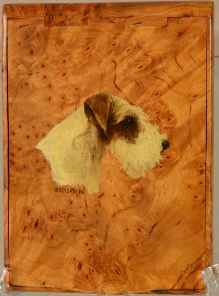 Russell Terrier by MA Dickman Cigarette Box: Hand-painted on burled walnut cigarette box featuring a lift top with dovetail hinges. Art deco style case signed. Circa 1925. 4 1/4" x 3"