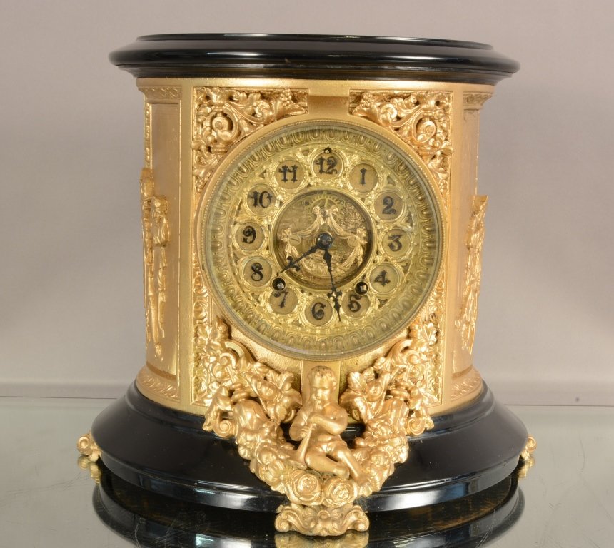 Ansonia Mantel Clock: Ansonia Mantel Clock with fancy dial and open escapment. Time and Strike. Gilted and ebonized case. 12"hX13"w ca. 1890