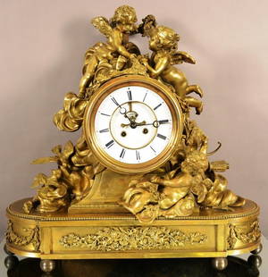 Massive French Louis XV Style Figural Mantel Clock: Massive French Louis XV Style Mercury Gilt Bronze Figural Mantel Clock with three Massive Cupids in the Clouds.This Has a 30 Day L. Marti Movement. Huge 8" Open Escapement Porcelain Dial. Has