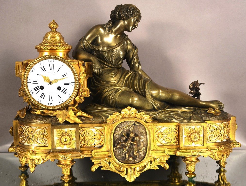 French Dore Gilt Bronze Lady Mantel Clock: French Dore' Gilt Bronze Lady Mantel Clock with Ormolu, Resting Near a Gilt Dome Topped Appeture, Feeding a Nest of Birds in a Pond to Her Left. Very Heavy Clock, Solid Bronze.Case with Marble Inserts