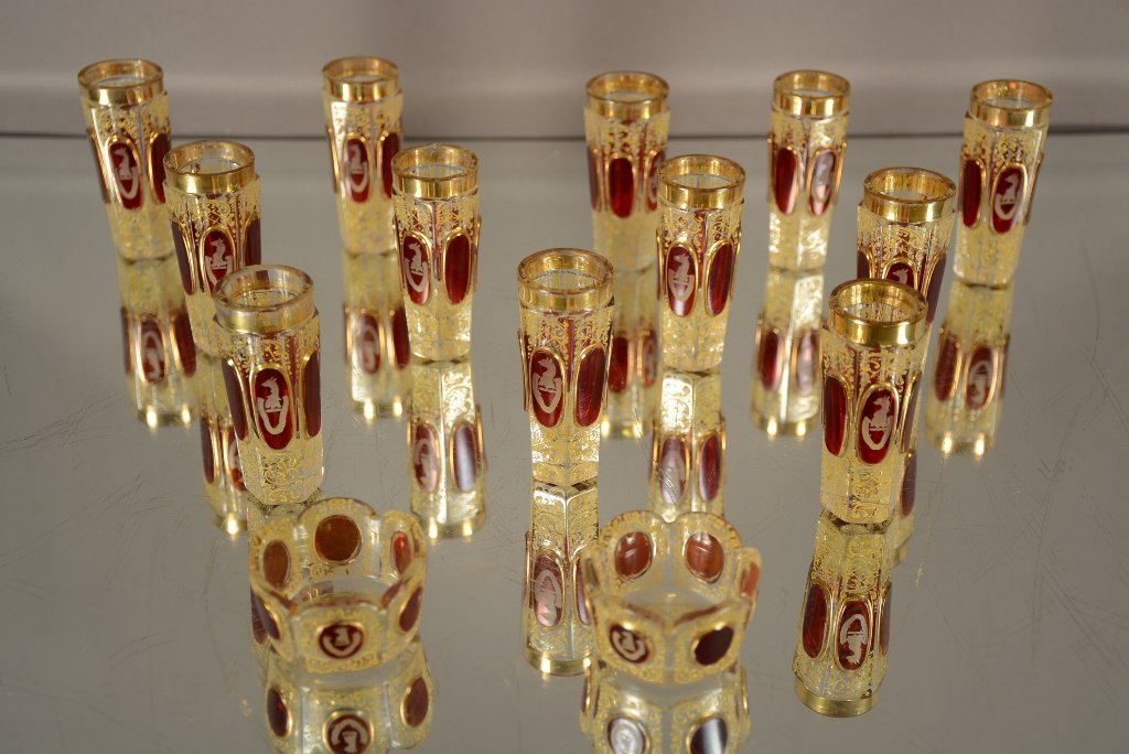 14 Pieces of Moser Style Shotglasses and Salts: 14 Pieces of Moser Style Enamel & Cranberry. 12 Shot Glasses and 2 Salts. Shots 3"t Salts 1"t ca. 1900