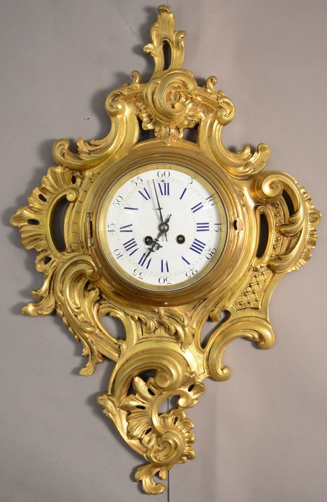 French Louis XV Style Dore Bronze Cartel Clock: French Louis XV style dore bronze cartel clock. Heavy flame & leaf decorated case. Porcelain dial. Time & strike. Early French clockmaker P. Japy & Co. Signed movement. ca. 1873. 25" tall x 16" wide