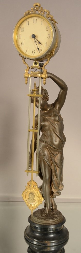 Ansonia Figural Swinger French Louis XVI Style: Ansonia figural swinger, French Louis XVI style with spelter figure holding mystery clock. Works singed Ansonia. March 22, 1877. 25" tall