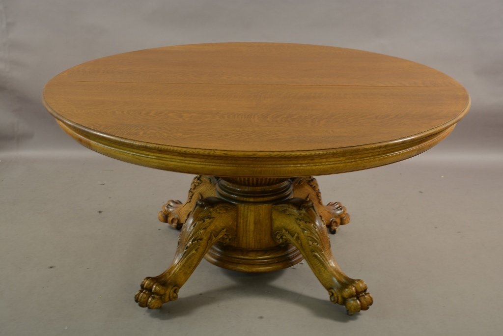 Turn of the Century 60" Round Claw Footed Table: Turn of the century 60" round oak claw footed dinning room table. Quartered oak with seven leaves. ca. 1900. 60" x 30" t