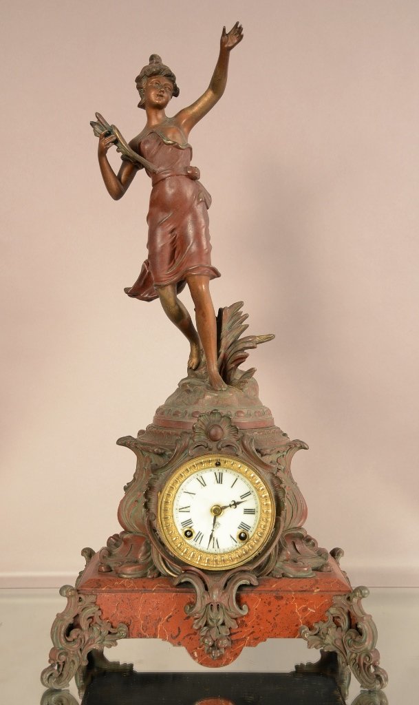 Ansonia Figural Mantel Clock with Spelter Statue: Ansonia figural mantel clock with spelter statue of woman holding flowers. Porcelain dial. Time and strike. Works signed Ansonia Clock Co. ca. 1890. 23" t x 18" w