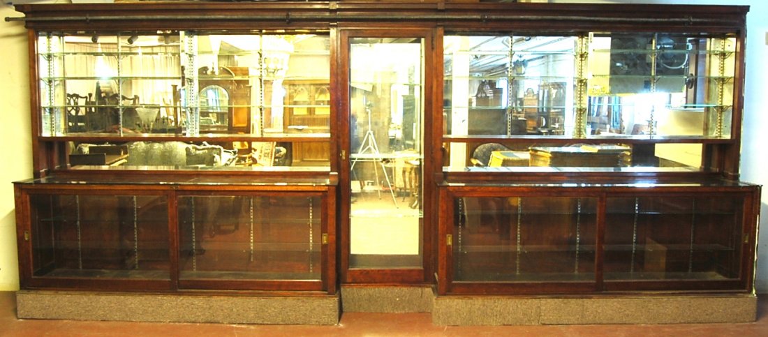 1920's Soda Fountain Back Bar: 1920's Soda Fountain Back Bar with mirrored back, glass shelves in top & center cabinet, sliding glass door in base. Mahogany Made by the Colorado Furniture Co. Denver, Colorado. 96" t x 18' 8" w x 30