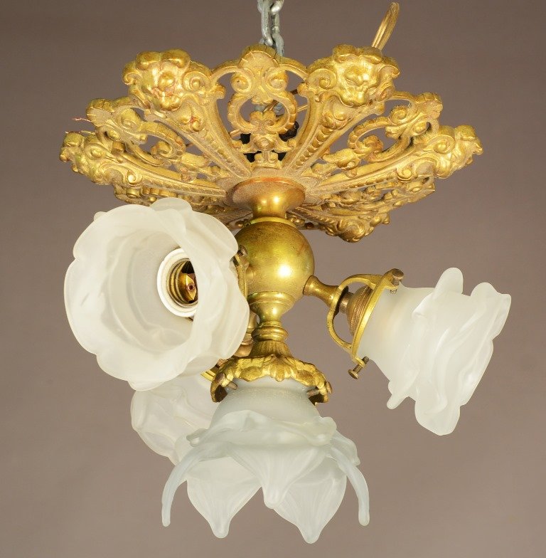 French Louis XIV Style Bronze Light Fixture: French Louis XIV style, four light, bronze light fixture with six lions heads decorating the top. ca. 1900. 11" t x 13" w