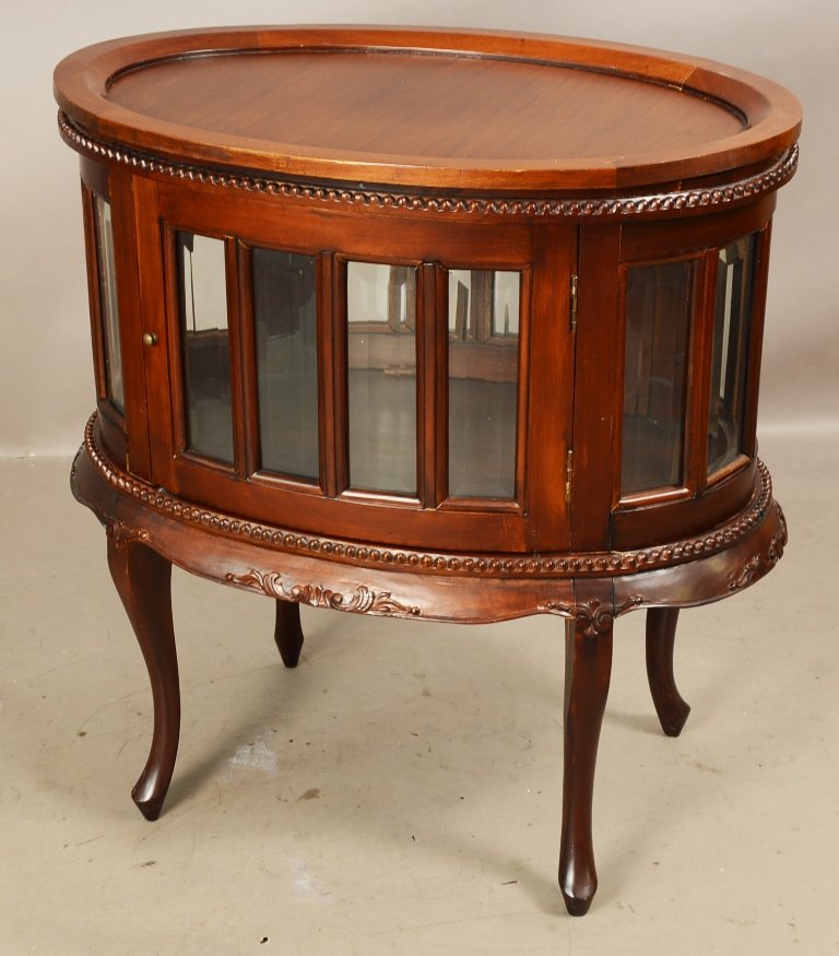 French style oval vitrine with serving tray on top: French style oval vitrine with serving tray on top, beveled glass sides, 2 doors, late 20th century, 31”t x 29”w.