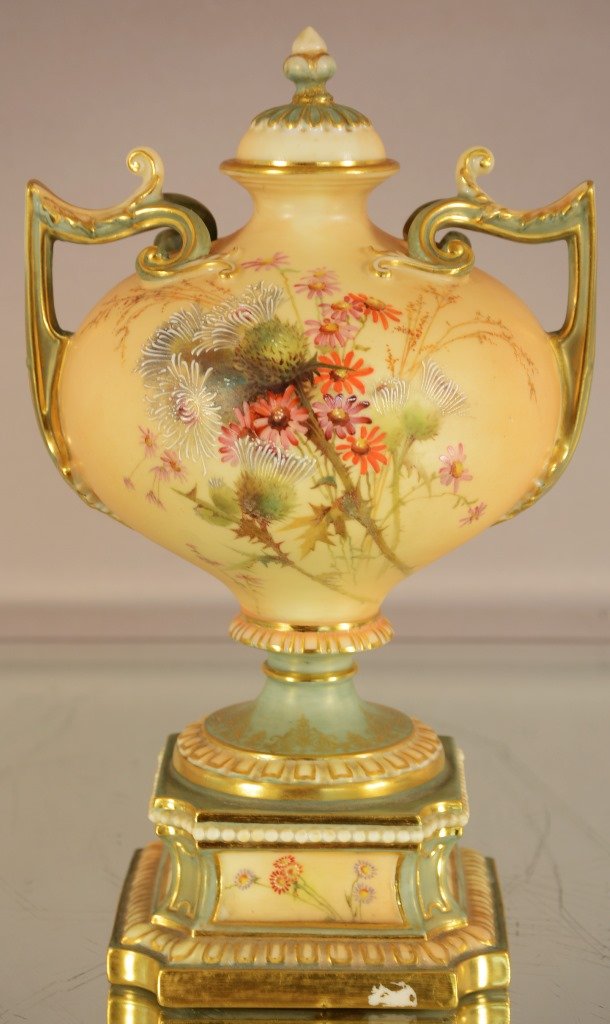 Royal Worcester pedestal vase with lid: Royal Worcester pedestal vase with lid, gilted & hand painted, floral decorated with gilting. Some gilting missing in front base. RN 304837. 1958. Signed on bottom. 9”t. Ca. 1890.