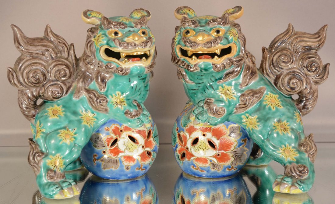 Pair of Oriental style porcelain foo dogs (1 of 2)