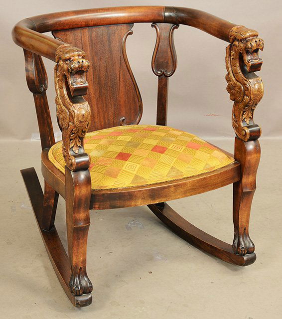 Victorian Empire style rocking chair: Victorian Empire style rocking chair with winged dragons carved on arms and claw feet. Mahogany. 31”t x 22”d x 25”w. American. Ca. 1900.