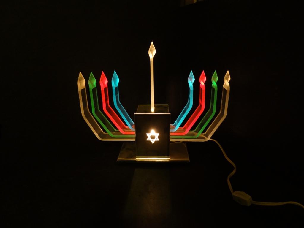 Menorah: Light Up Lucite ca. 1970: A wonderful Lucite Menorah that lights up. Measures 11" height x 14" wide. Candles can be turned on one at a time!