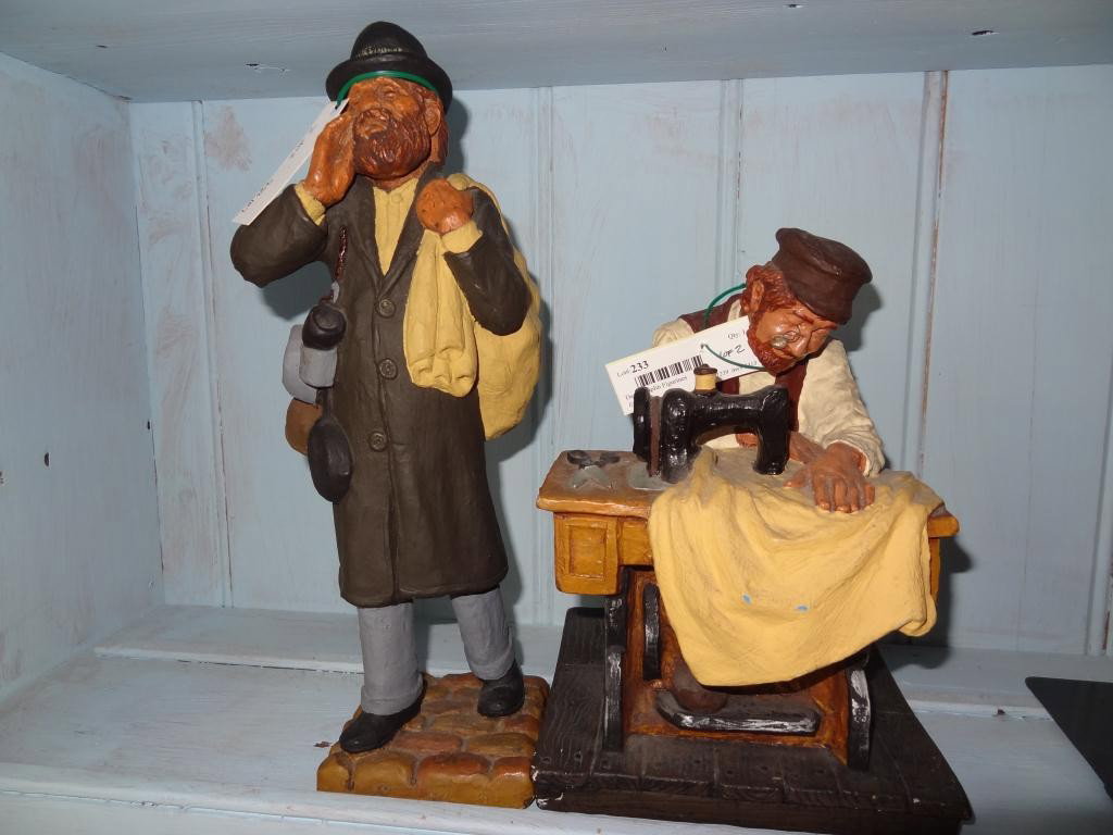 David Kaplin Figurines (2): Two David Kaplan chalkware figurines. Man with sewing machine. Measures 6.5" W x 6"D x9"H. Minor Chips Tall Man carrying bag measures 3.5" W x 3.5 D x13"H Good Condition The small statue measures 6.5"