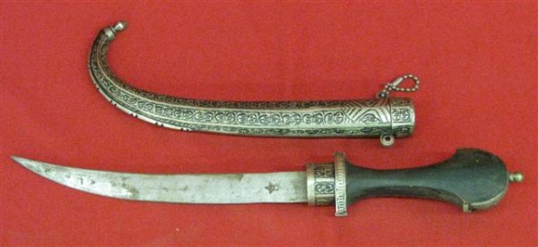 Knife, Middle Eastern Origins, Silvered Scabbard a: Knife, Middle Eastern Origins, Silvered Scabbard and Embellishments, Mid 20th Century, 15'' L with Scabbard, $50-$75.
