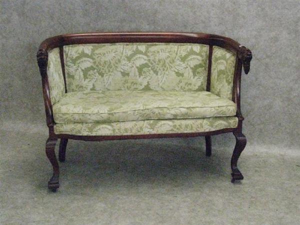 Settee, Early 20th Century, Maple with Cherry Fini: Settee, Early 20th Century, Maple with Cherry Finish, Arms Terminate in Lion's Head Embellishments, 31 1/2'' H x 48'' W x 24'' D, Matches Lot 316, $100-$150.