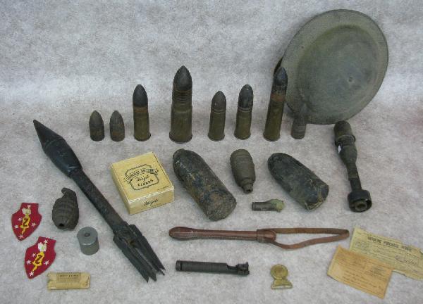 WWII Artifacts, Estate Lot, Incl. Various Rations, P: WWII Artifacts, Estate Lot, Incl. Various Rations, Patches, Dummy Grenade, Various Projectiles, Naval Helmet, Etc., from the Ware Family Collection, $100-$150.