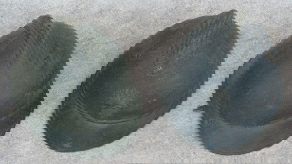 Helmets, 2, English, Steel, (A) Flaming Bomb Crest w: Helmets, 2, English, Steel, (A) Flaming Bomb Crest with ''RF'' in Relief, 5'' H x 8 1/2'' W x 11 3/4'' D, (B) 5'' H x 8 1/4'' W x 11 3/8'' D; Liners Present (with Loss), from the Ware Family Collectio