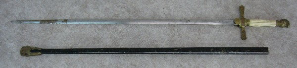 Sword, Militia Type, 19th Century, Knight's Head Po: Sword, Militia Type, 19th Century, Knight's Head Pommel, Grip Possibly Bone, Blade Unmarked, Painted Steel Scabbard, Brass Drag, 36 1/4'' L, $75-$100.
