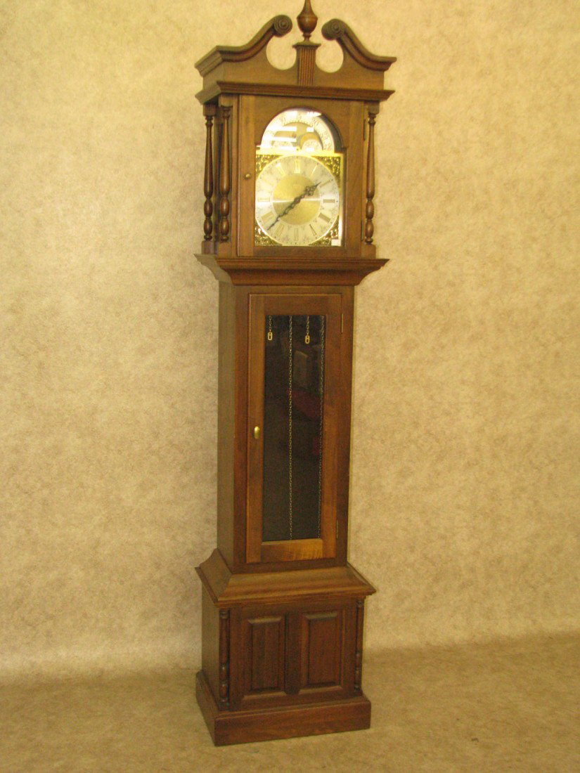 Tall Case Clock: Clock, Tall Case, Walnut Case, Moon Phase Dial, Heritage, 83 1/2'' H x 19 1/2'' W x 12 1/2'' D.