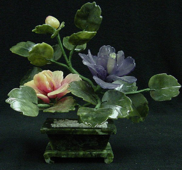 Small Jade Bonsai Flowers: This flower is made of natural southern jade. All hand carved. The leaves and pot are made of Taiwan jade, dark green. The branches can be bend over so you may adjust the way you like. Size: L: 7", W: