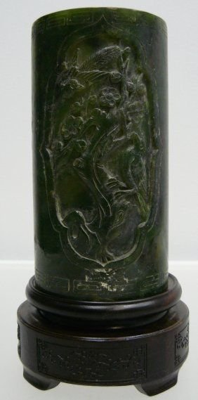 High Quality Jade Pen Holder: This is a pen holder, made from one solid piece of high quality jade. It appears light and dark green. It is transparent. Some flowers and trees are carved on the surface. Size: Diameter: 3.5", High: 