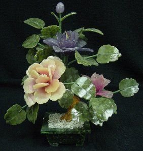 Jade Bonsai Flowers: This flower is made of REAL jade. The leaves are made of Taiwan jade, dark green, as well as the pot. The branches can be bend over, so you can adjust it the way you like. Size: L: 12", W: 8", H: 13".