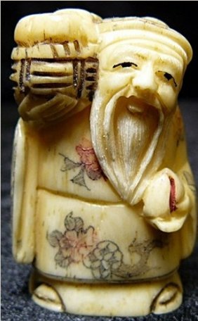 1205: 2" Antique Bone Netsuke (N053): This Netsuke is made from one solid piece of bone. All hand carved and hand painted. It has signature on the bottom. Very detailed carving. BG