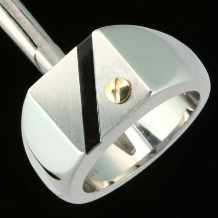 Men's Black Onyx & 14K Gold Stainless Ring: Men's Black Onyx & 14K Gold Stainless Steel RingBlack Onyx w/ 14K Gold ScrewSetting Type: Bold Square Face High Polish Stainless SteelMetal Type: Stainless Steel & 14K Yellow GoldMetal Stamp: S. Ste