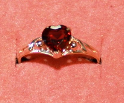 2ct Garnet 14k Gold Ring: 2ct heart shaped garnet solitaire set in gold filigree band.