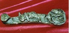 139D: JADE LUCKY ROYAL STICK (HJ070E): This is a jade lucky royal stick. Chinese name Ruyi. It was used in ancient China for emporors. Representing power and good luck.Size: L: 10", W: 3", H: 3". BG