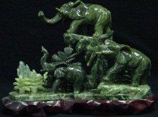 303S: JADE 3 ELEPHANTS MOUNTAIN: SKU: J150 THE ELEPHANTS ARE MADE OF TAIWAN JADE IN CHINA. IT IS IN LIGHT AND COOLING GREEN COLOUR AND GLOSSY SURFACE. THEY ARE CARVED FROM ONE WHOLE PIECE OF SOLID JADE. ELEPHANTS FAMILY ARE PLAYING O