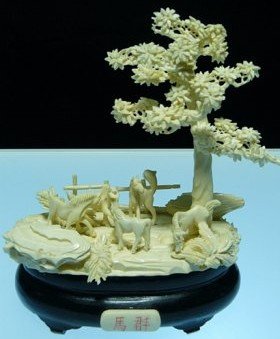 BONE HORSES JUNGLE: 9812A2 This beautiful art work is all hand carved from natural elephant bone. It comes with a rosewood stand. Size: L: 7", W: 4", H: 8". s00150