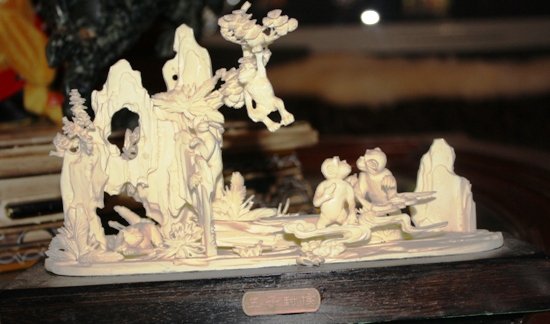 Bone Monkey Jungle: Beautifully carved bone Monkey Jungle on wood base. Sculpture is about 10x4x6 1013cch