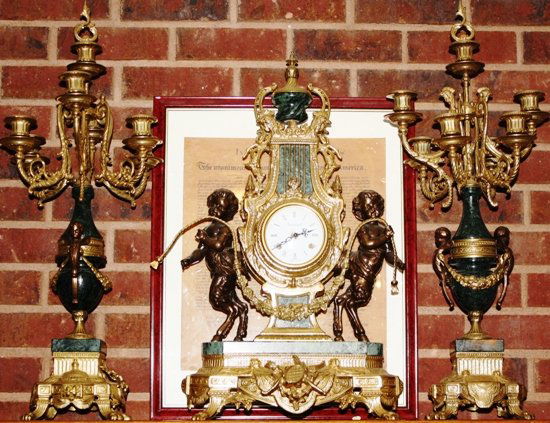 Louis XV Clock and Candleabra Set: Bronze Louis XV Keywind Clock with Bornze and Porcelain Candelabra. Clock is about 18x8x24 Candelabrum are about 11x11x27 1004cch
